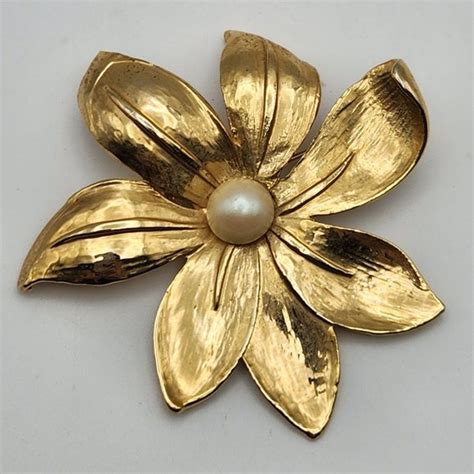 aai brooches